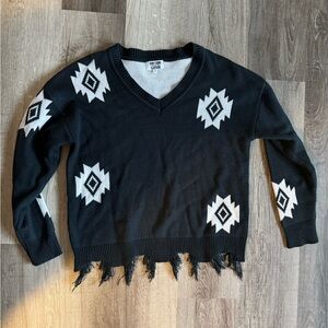 Chic Black and White V-Neck Sweater with Fringe